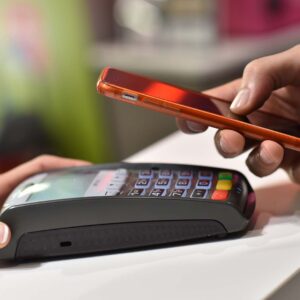 Purchase made at a businesses using a POS terminal and a smartphone.
